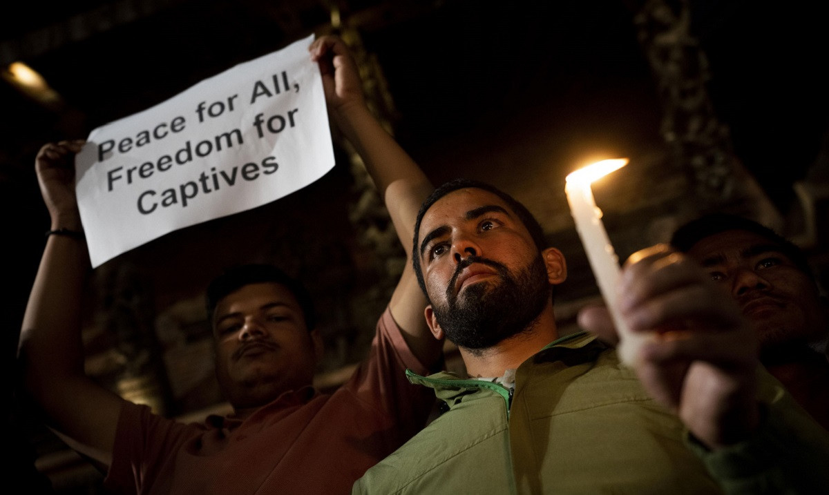 Students-light-candles-in-nepal_israiel-war2-ap-1696864487.jpg